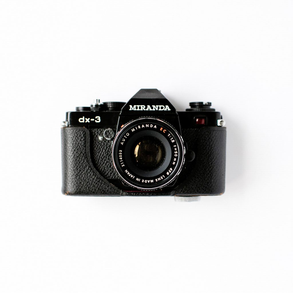 photo of Black film camera on white background
