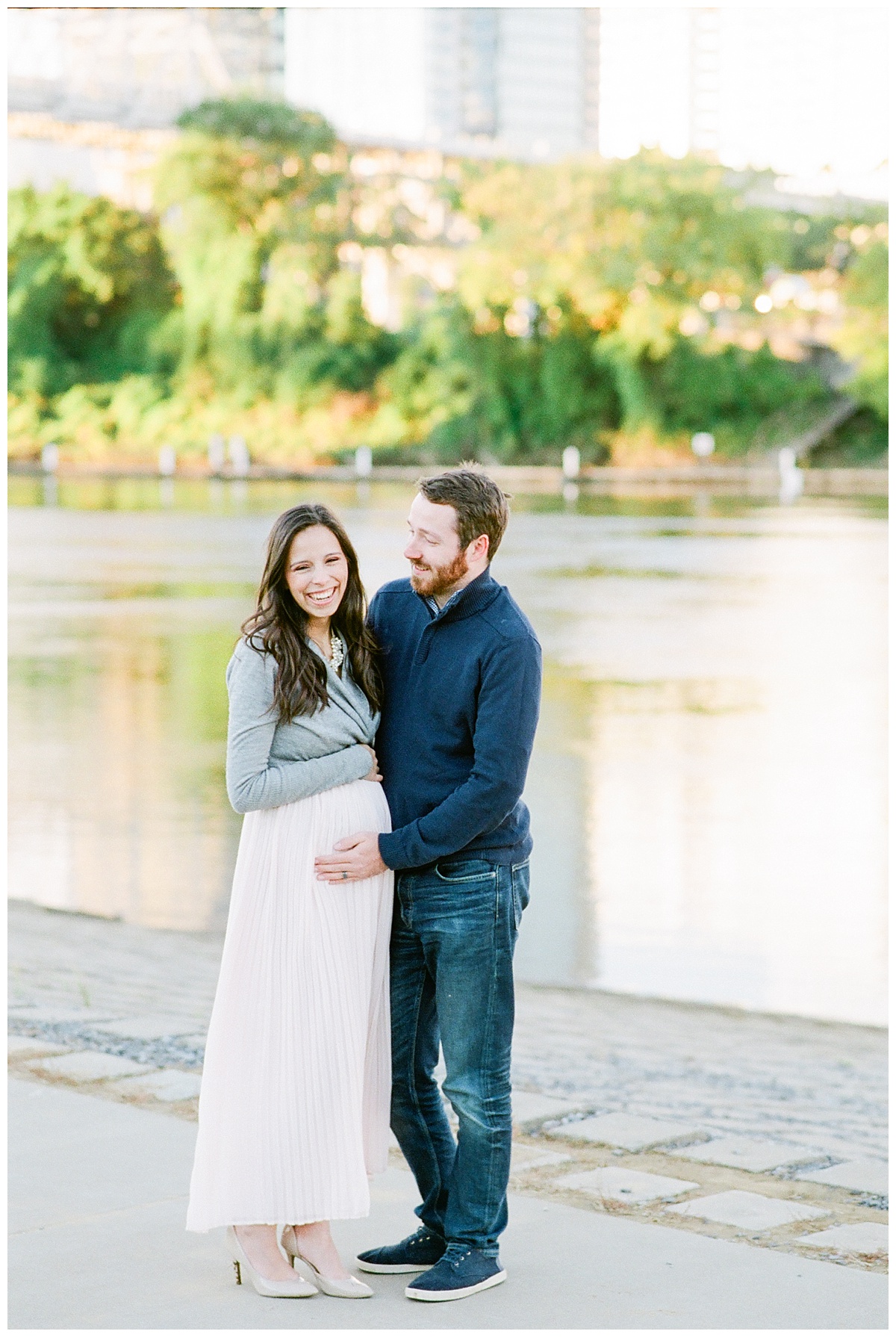Nashville Couple walks downtown by the river during their maternity session by Grace Paul Photography. 
