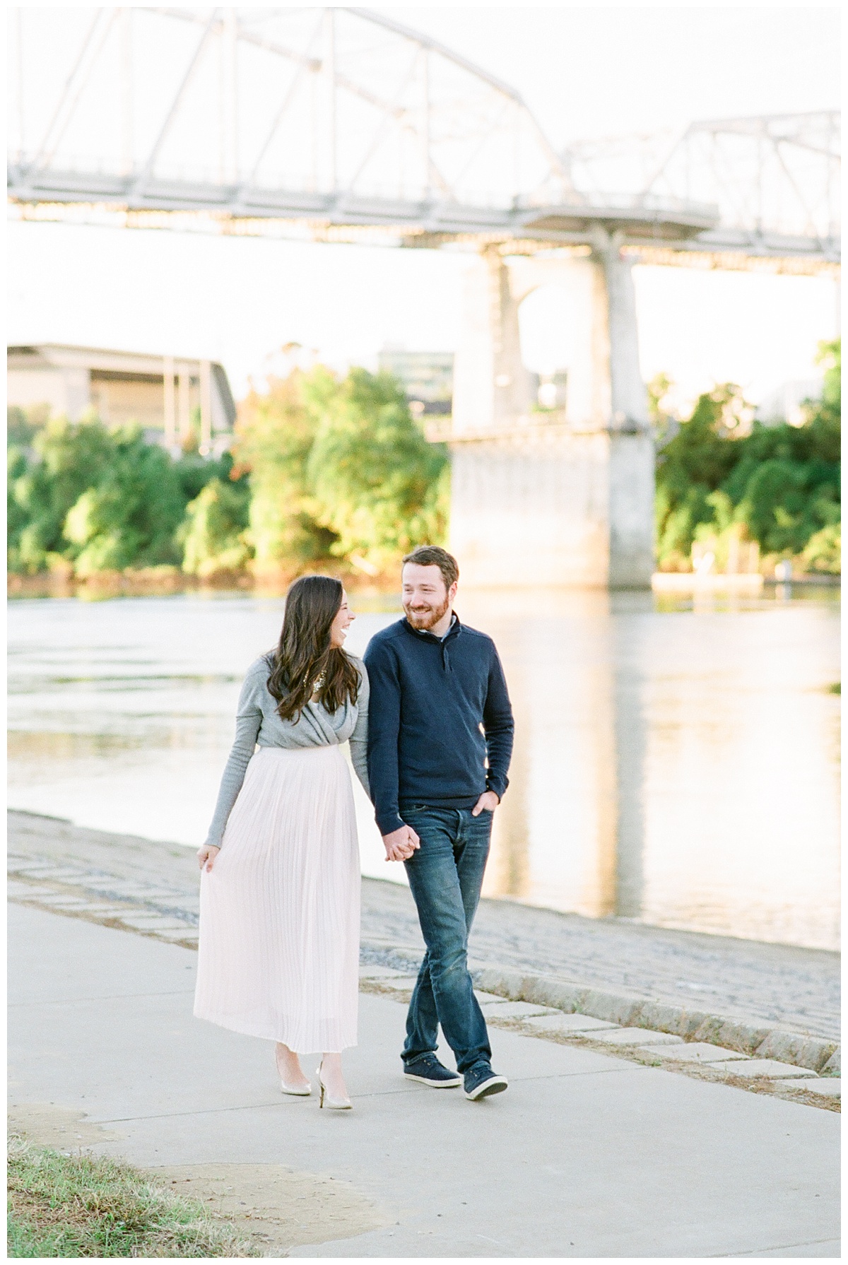 Nashville Couple walks downtown by the river during their maternity session by Grace Paul Photography. 