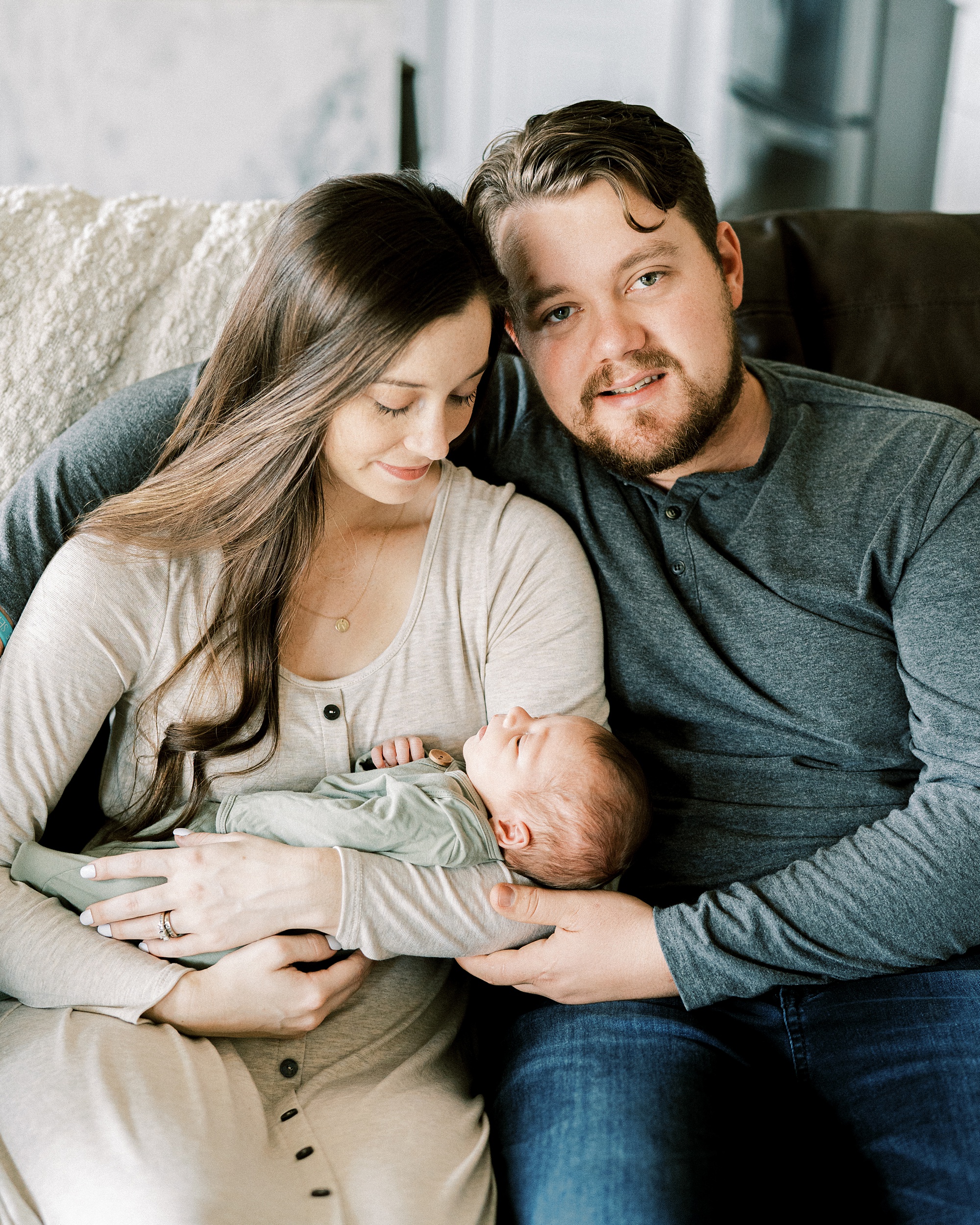 dad holds mom and newborn baby boy during TN In Home Lifestyle Newborn photos