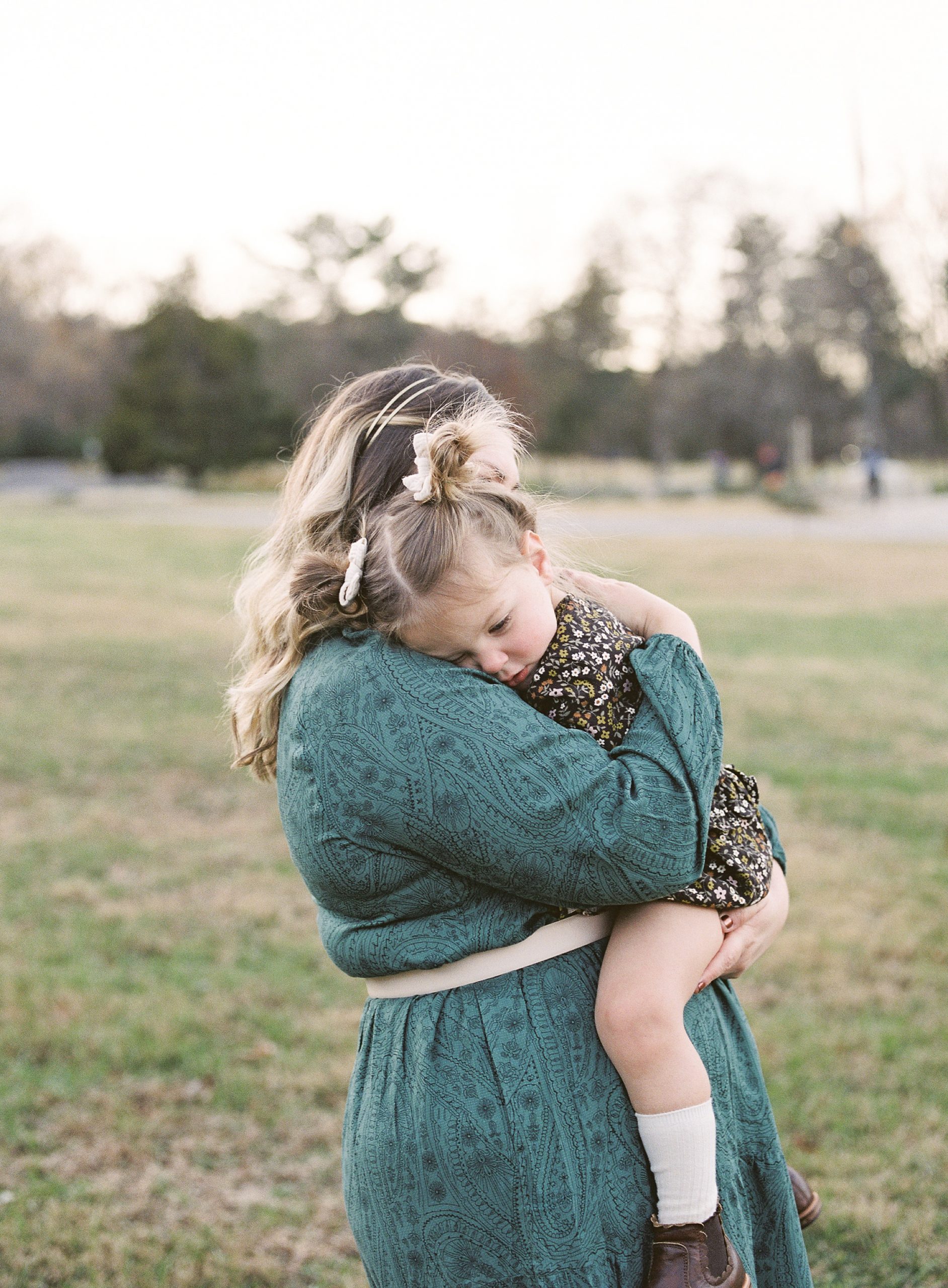 little girl hugs mom during photos in Nashville TN