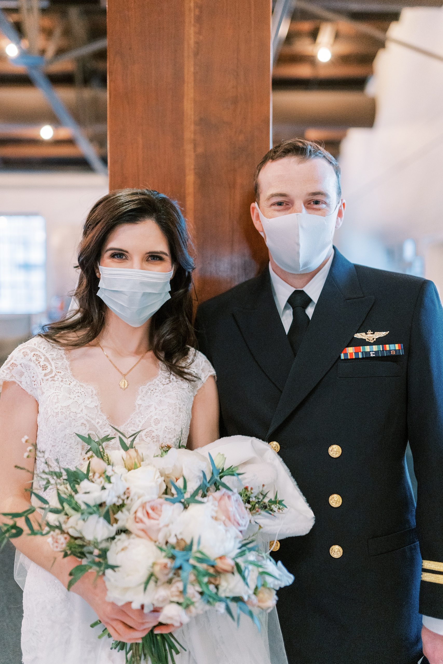bride and groom pose with masks on during intimate Nashville wedding