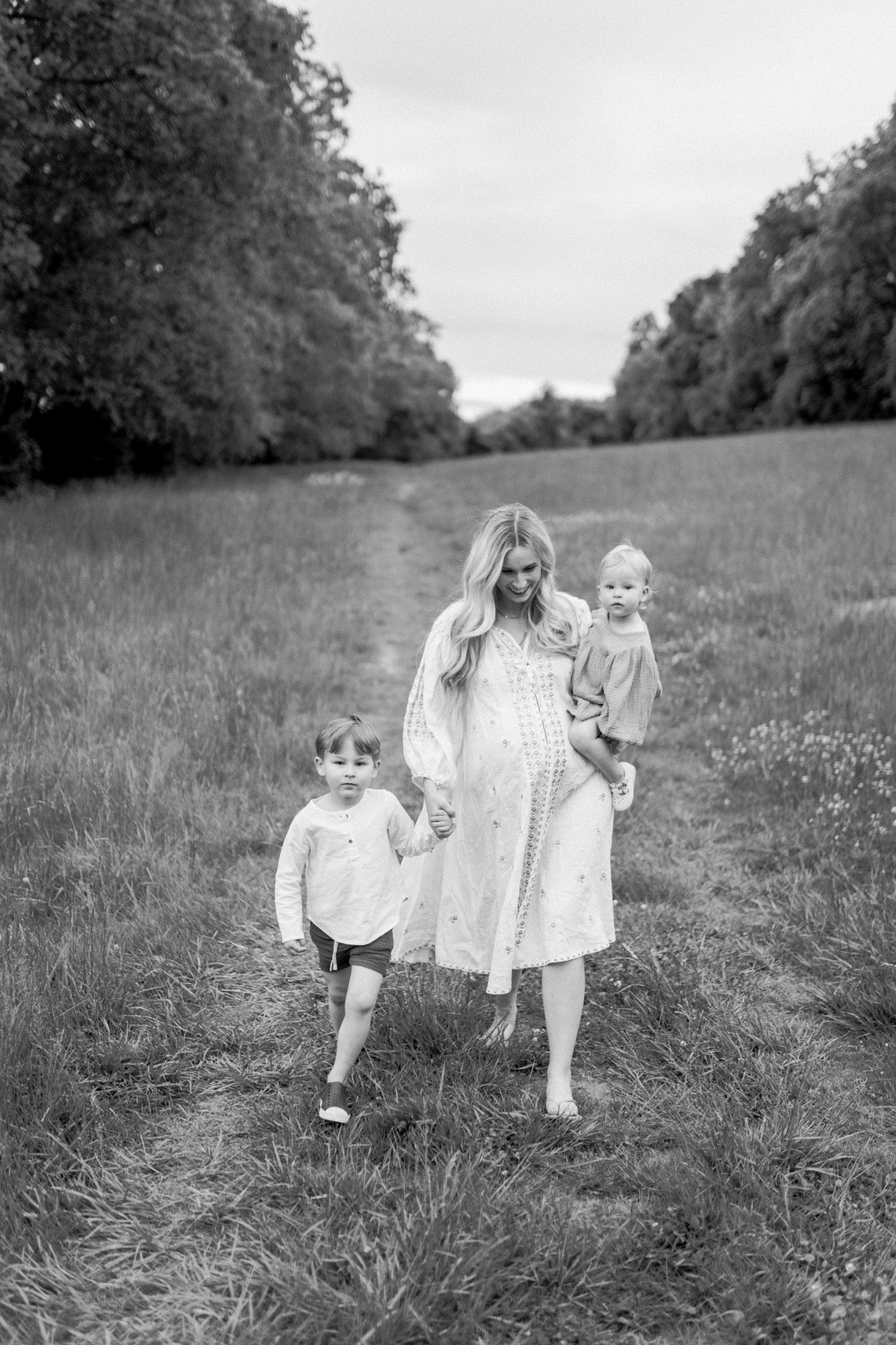 Mom walks with two kids during Mom + Me Session in Brentwood TN