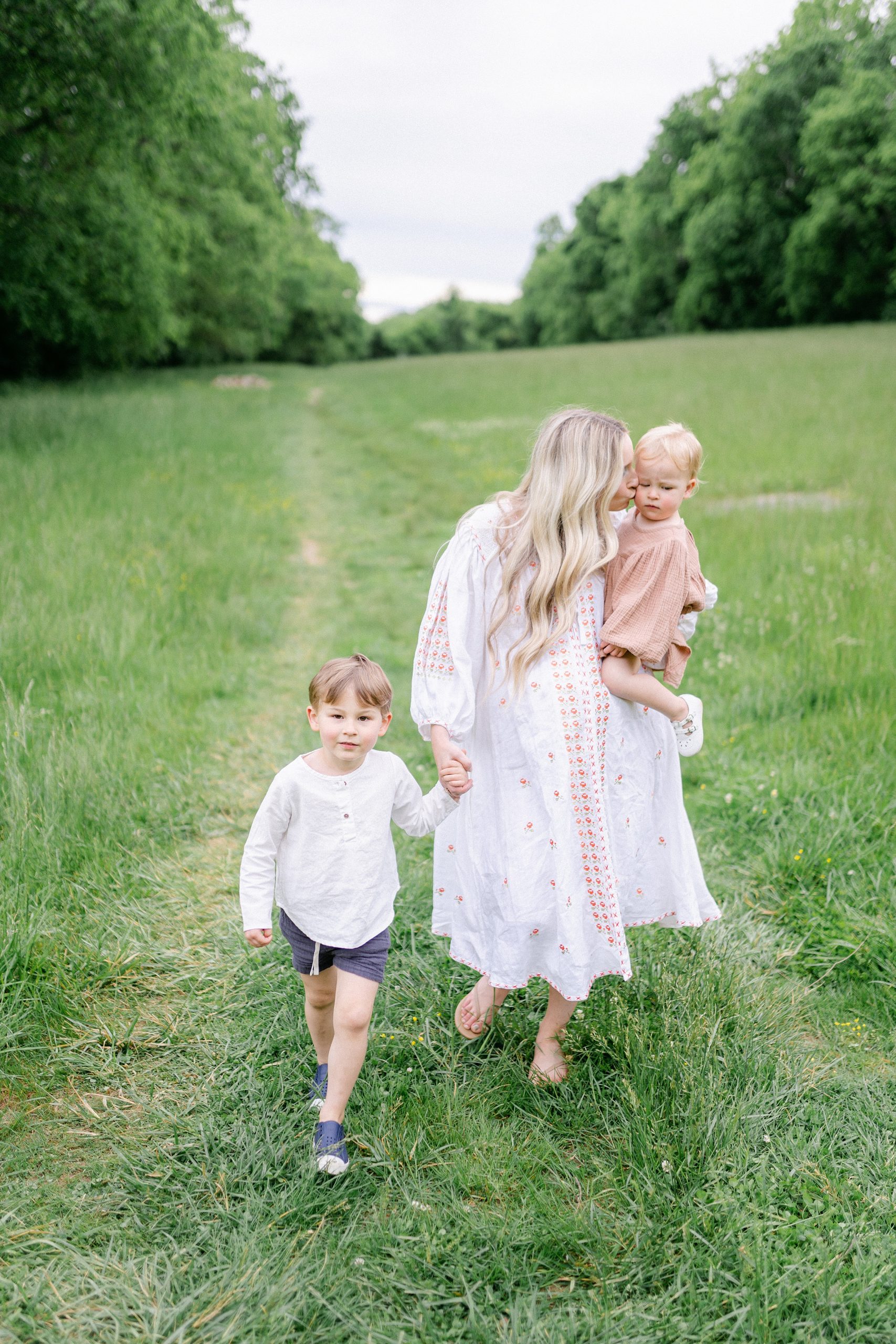 Mom walks with two kids during Mom + Me Session in Brentwood by Grace Paul Photography