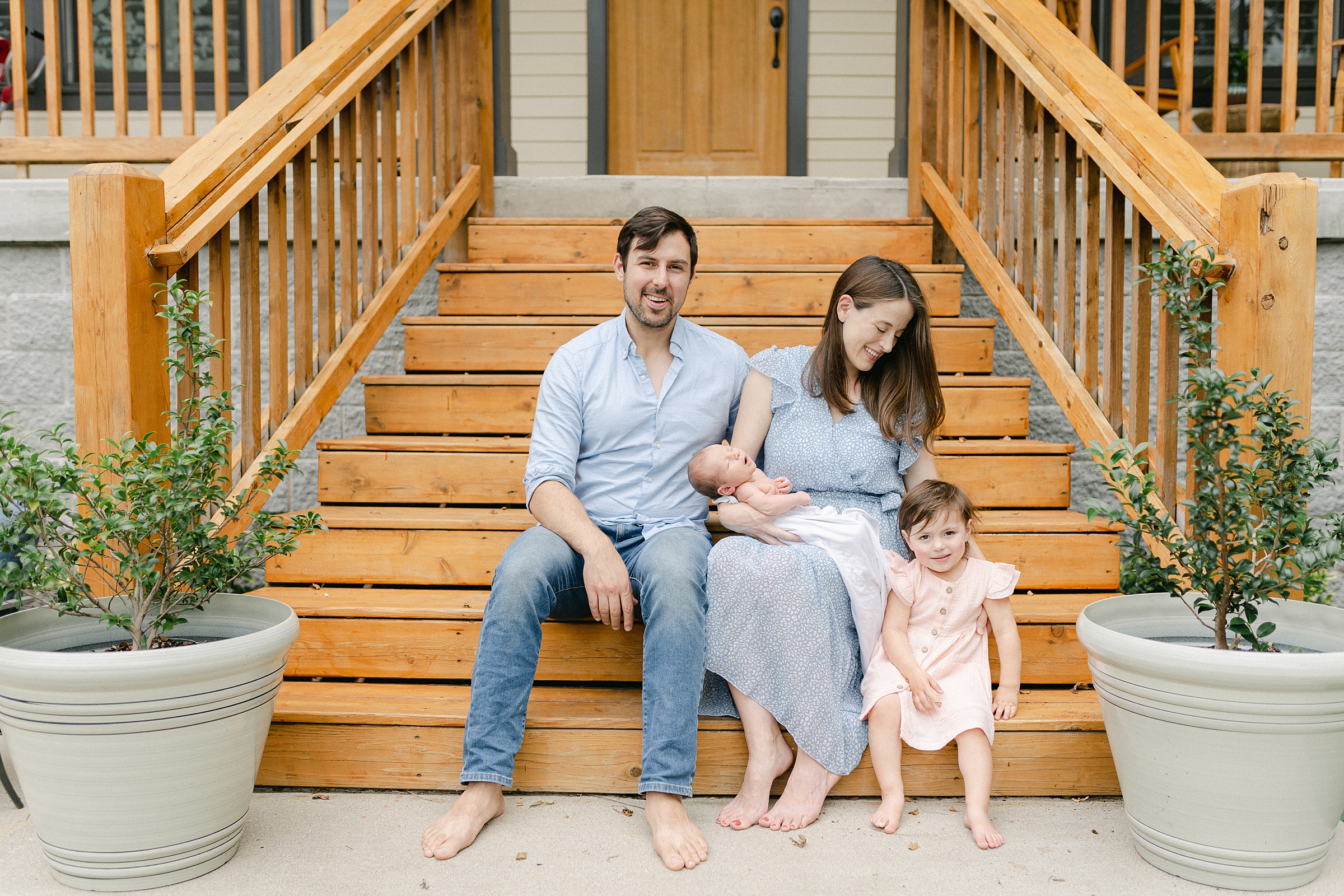 Nashville family sits on front steps during Nashville Lifestyle Newborn Session by grace paul photography