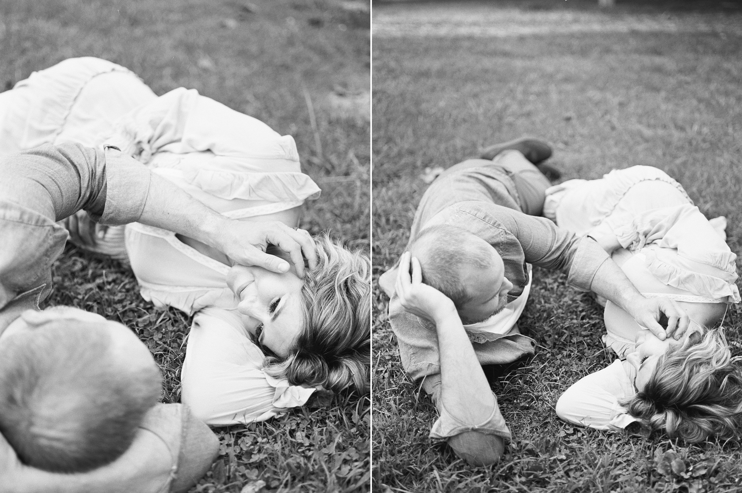 couple lays in grass as husband strokes wife's hair during Nashville TN Maternity session at Ellington Agricultural center