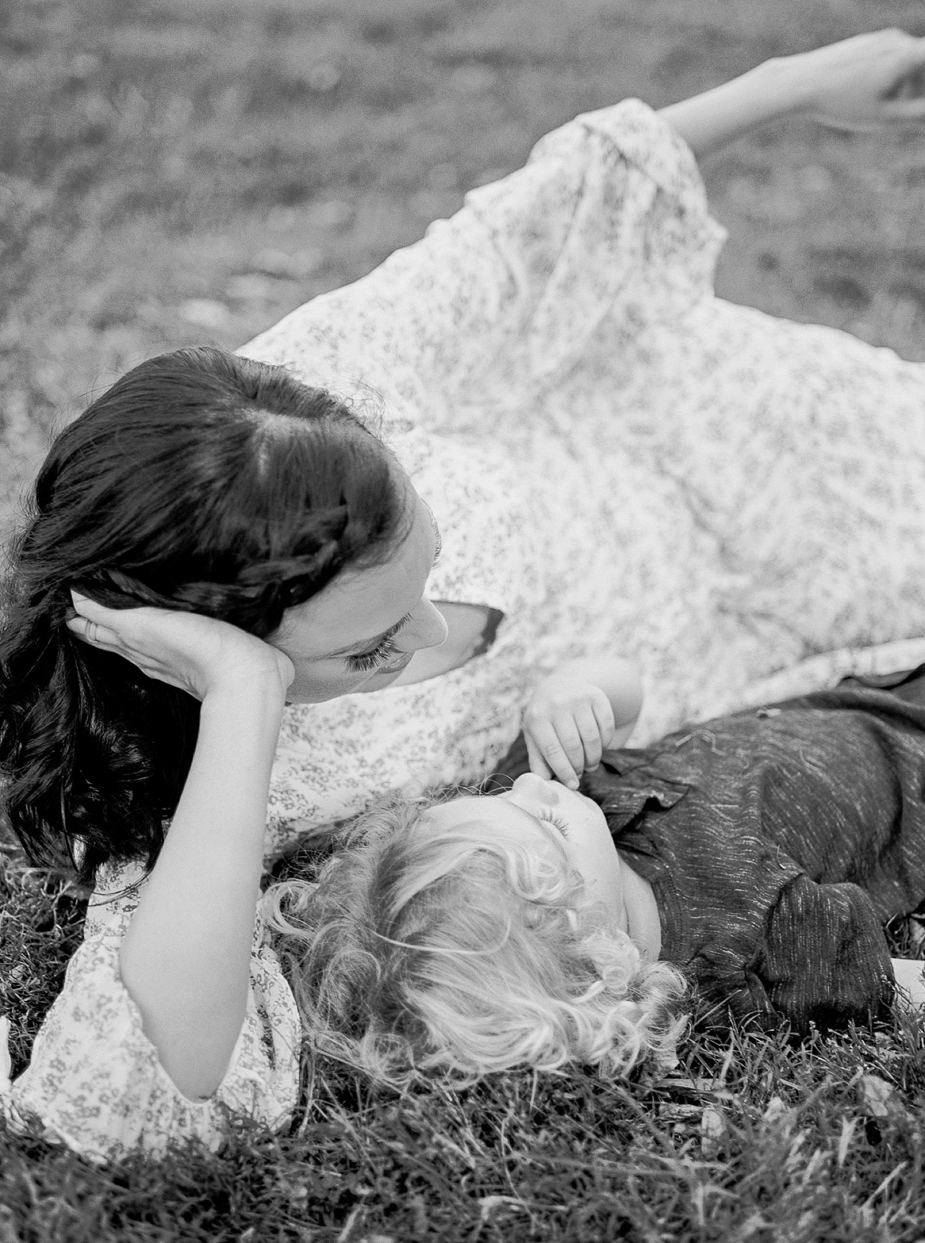 mom lays in the grass with her son during Nashville Family Session