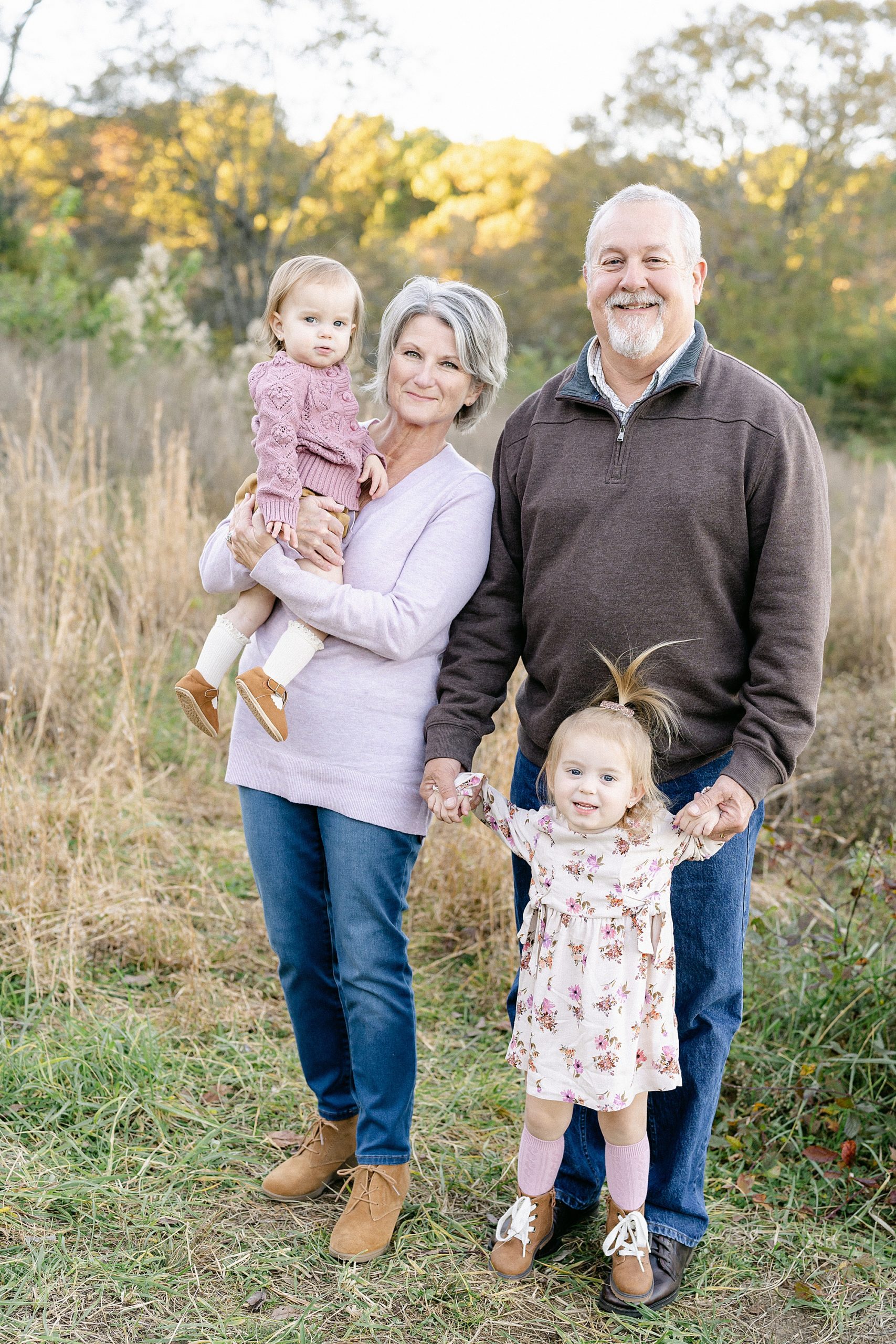 Grandparents hold their granddaughters during Brentwood TN Extended Family session