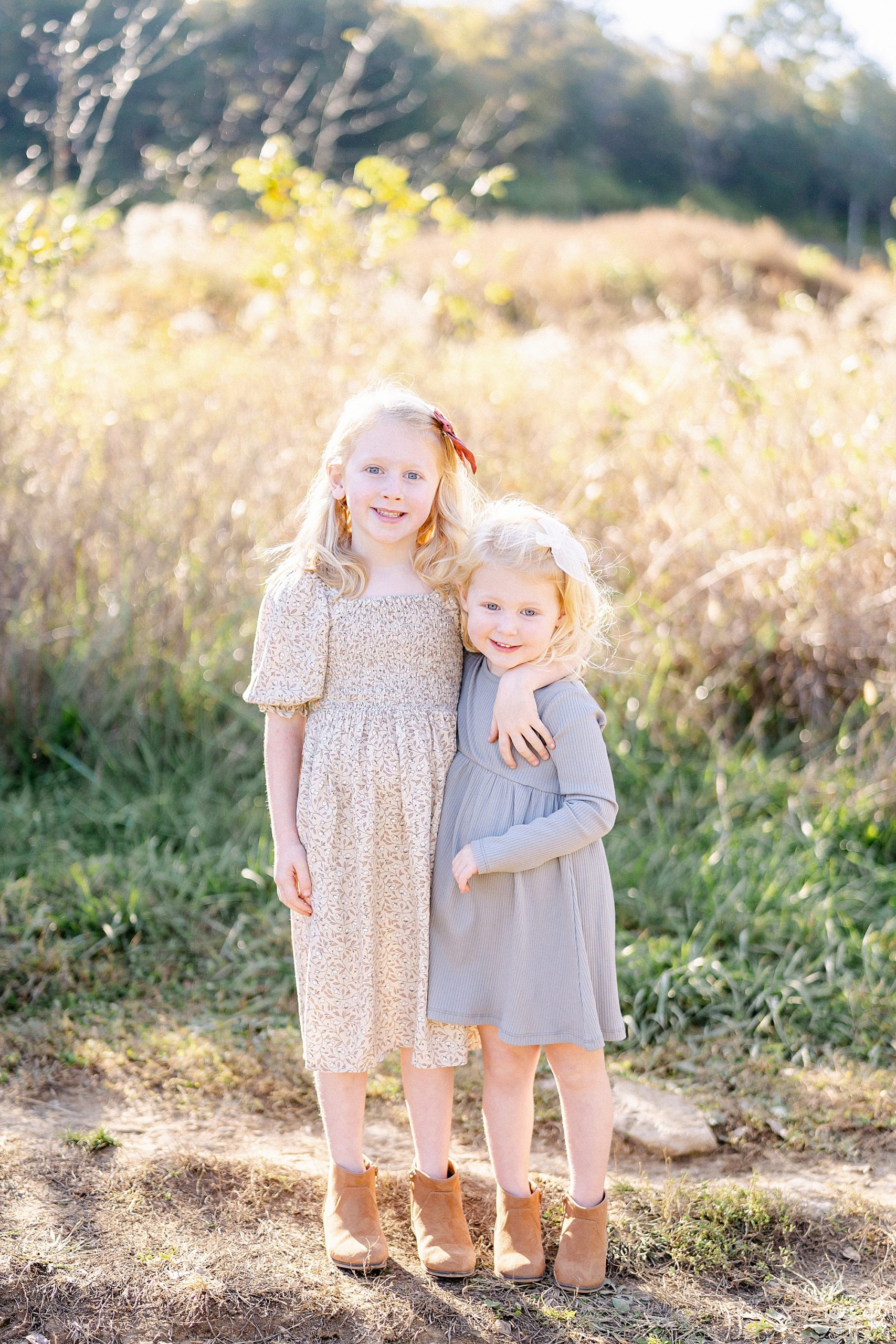 two sisters hug each other during Brentwood Tennessee Family Session