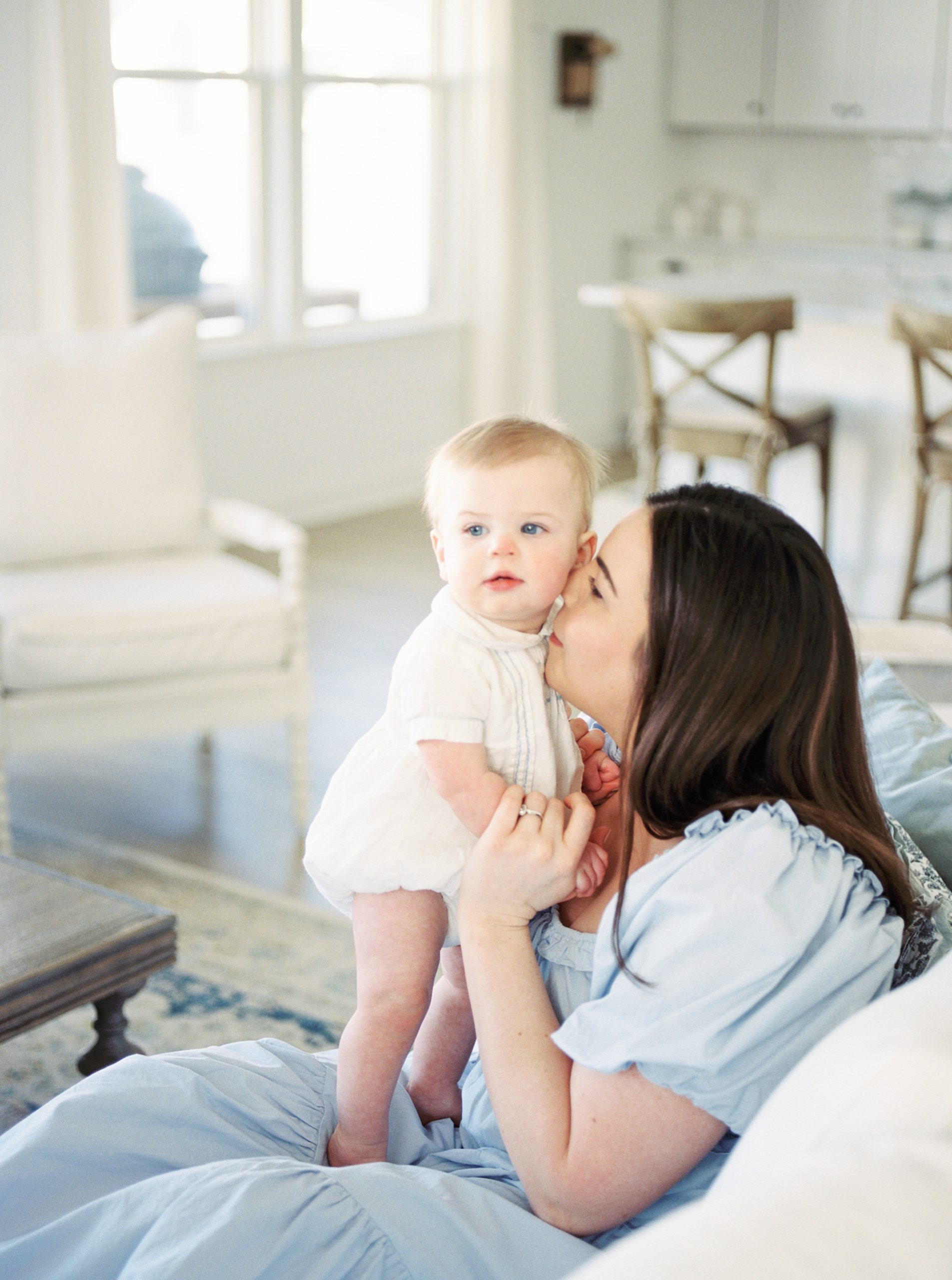 mom kisses on during in-home lifestyle session in Murfreesboro TN 