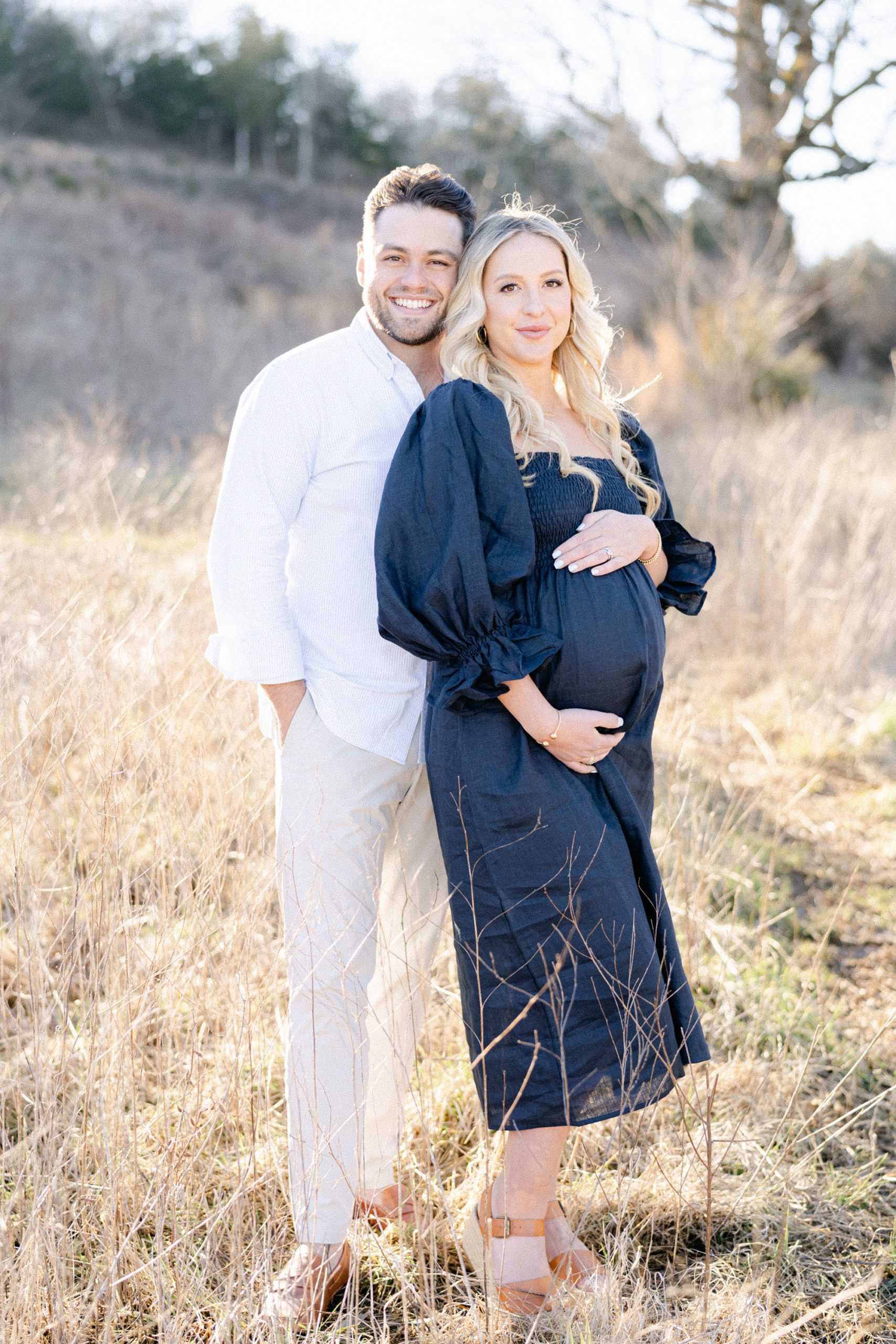 expectant parents stand together during Brentwood Maternity Portraits