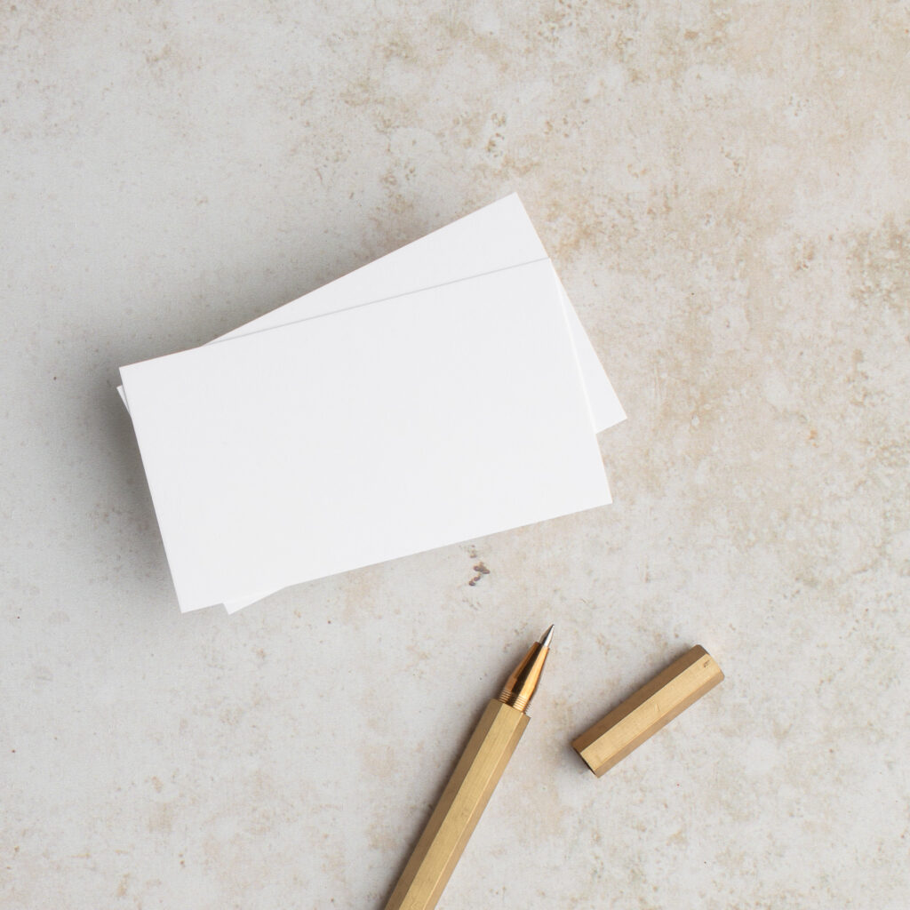 picture of blank notecard and gold pen