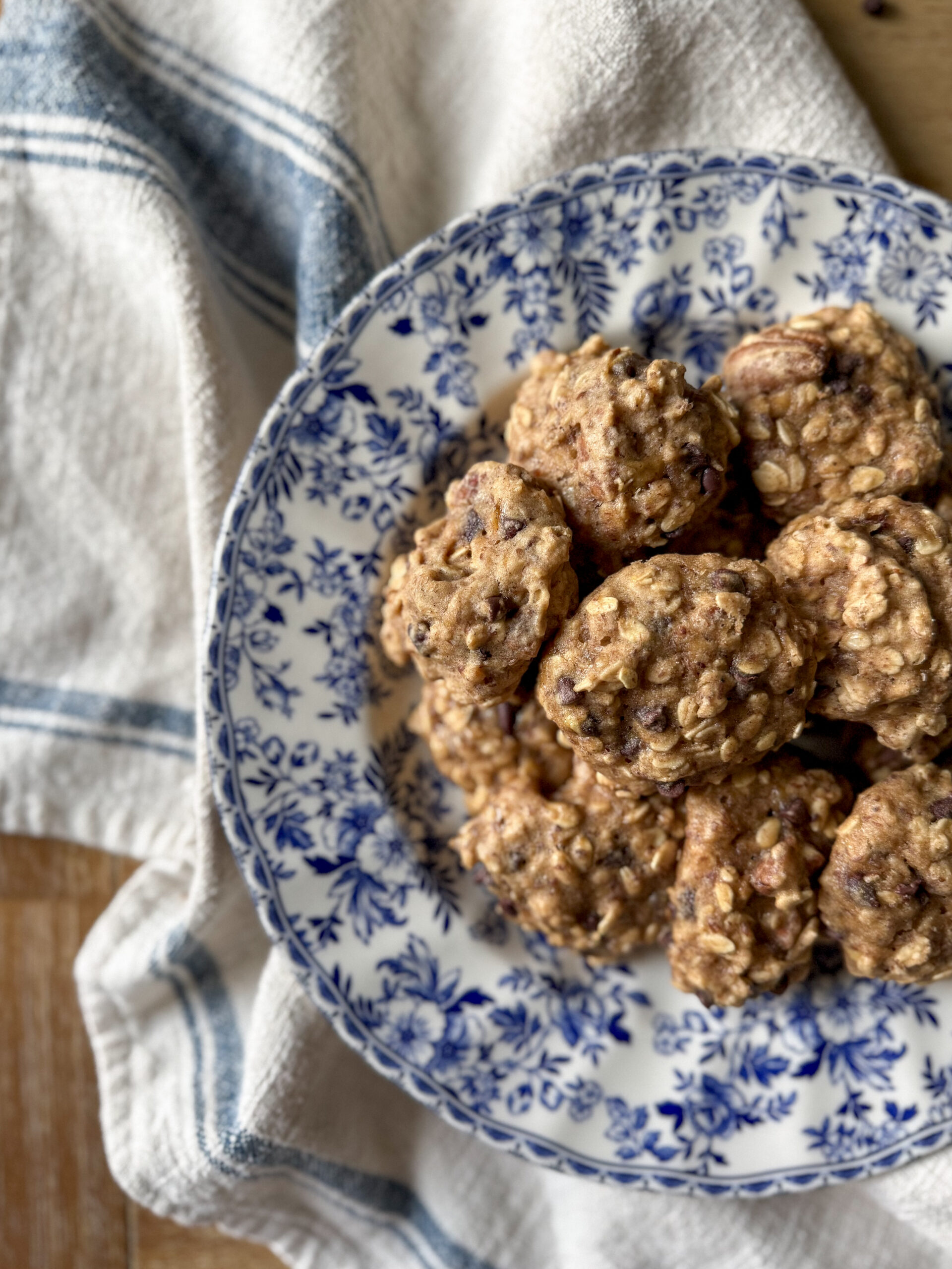 Budget-friendly clean ingredient breakfast cookies on a rustic wooden surface.