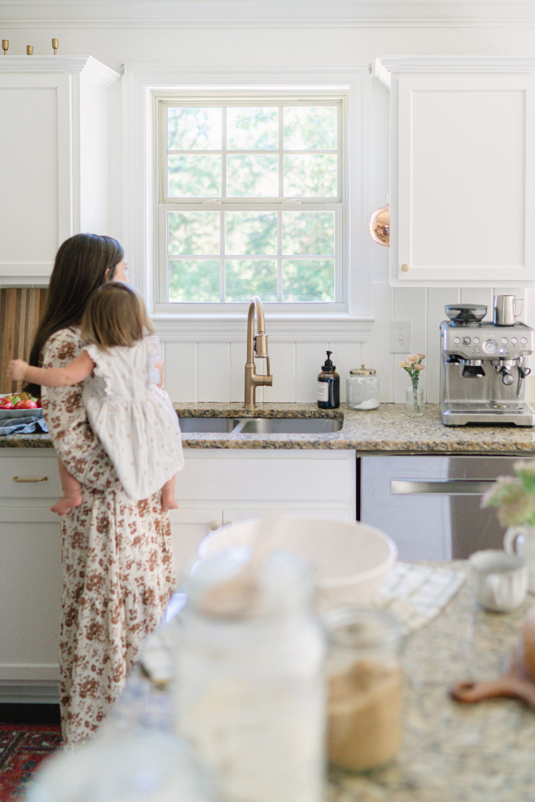 mom and daughter standing in the kitchen preparing to make beef stew